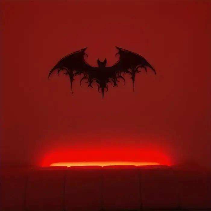 Sculpture murale en métal noir en forme de chauve-souris