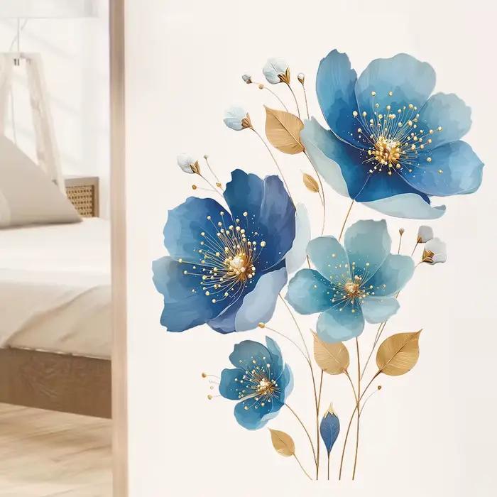 Autocollant mural floral bleu doré.