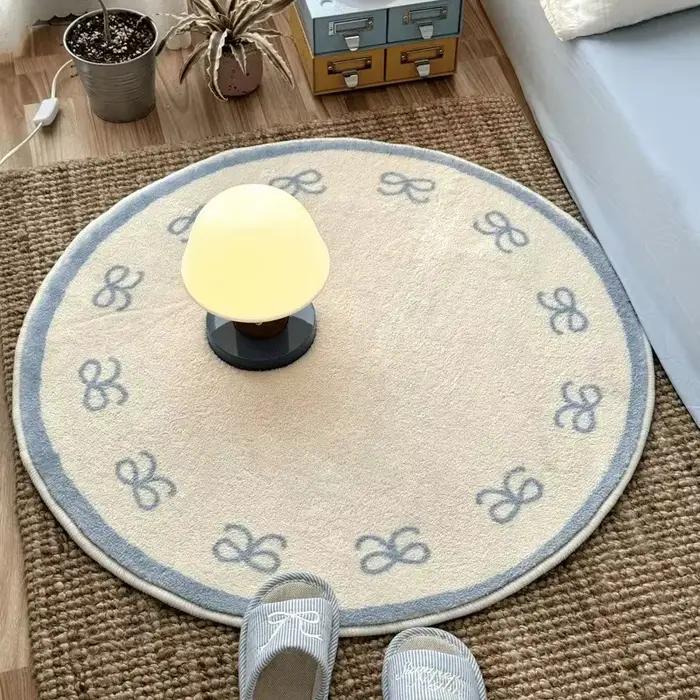 Tapis rond doux et moelleux bleu avec nœud papillon