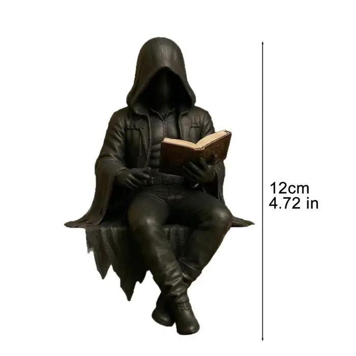 Figurine homme en robe assis