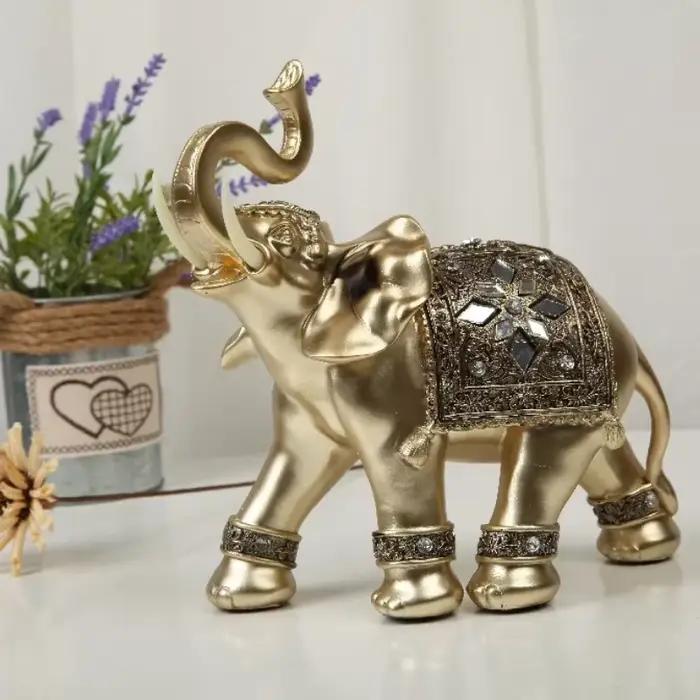 Statue d'éléphant en résine dorée
