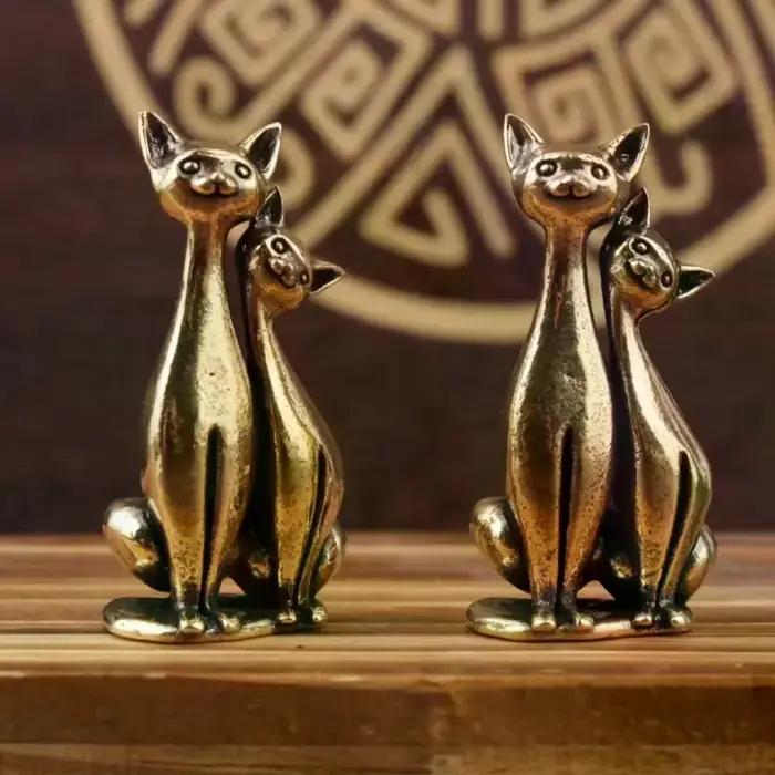 Sculpture de chat double en laiton