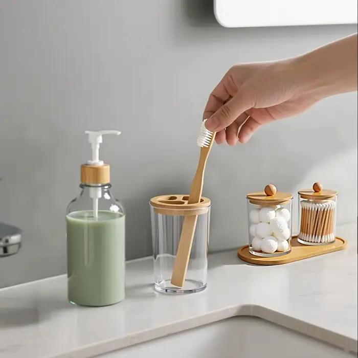 Ensemble d'accessoires de salle de bain en bambou, avec plateau, distributeur de savon en plastique, porte-brosse à dents transparent et 2 supports Qtip, boule de coton, 5 paquets