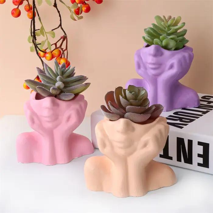 Pot de jardinière de visage abstrait
