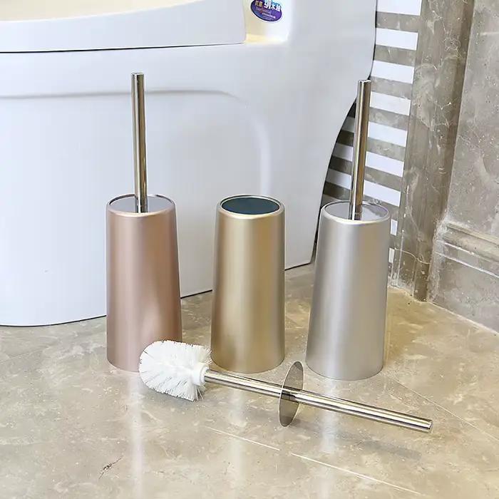 Brosse de toilette dorée avec support