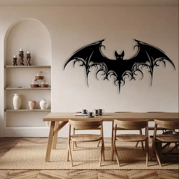 Sculpture murale en métal noir en forme de chauve-souris