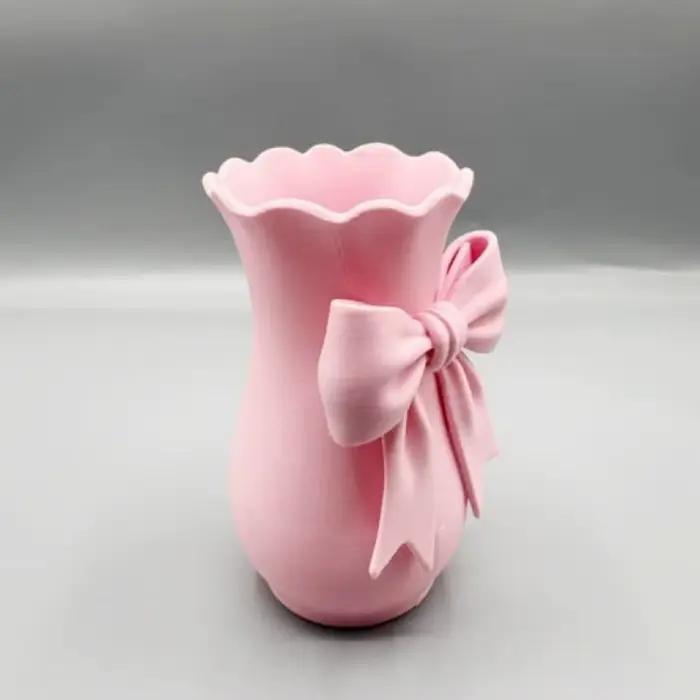 Vases à fleurs en forme de nœud rose au design torsadé