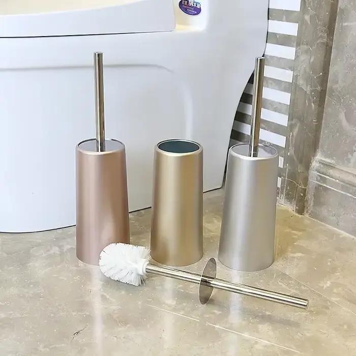 Brosse de toilette dorée avec support